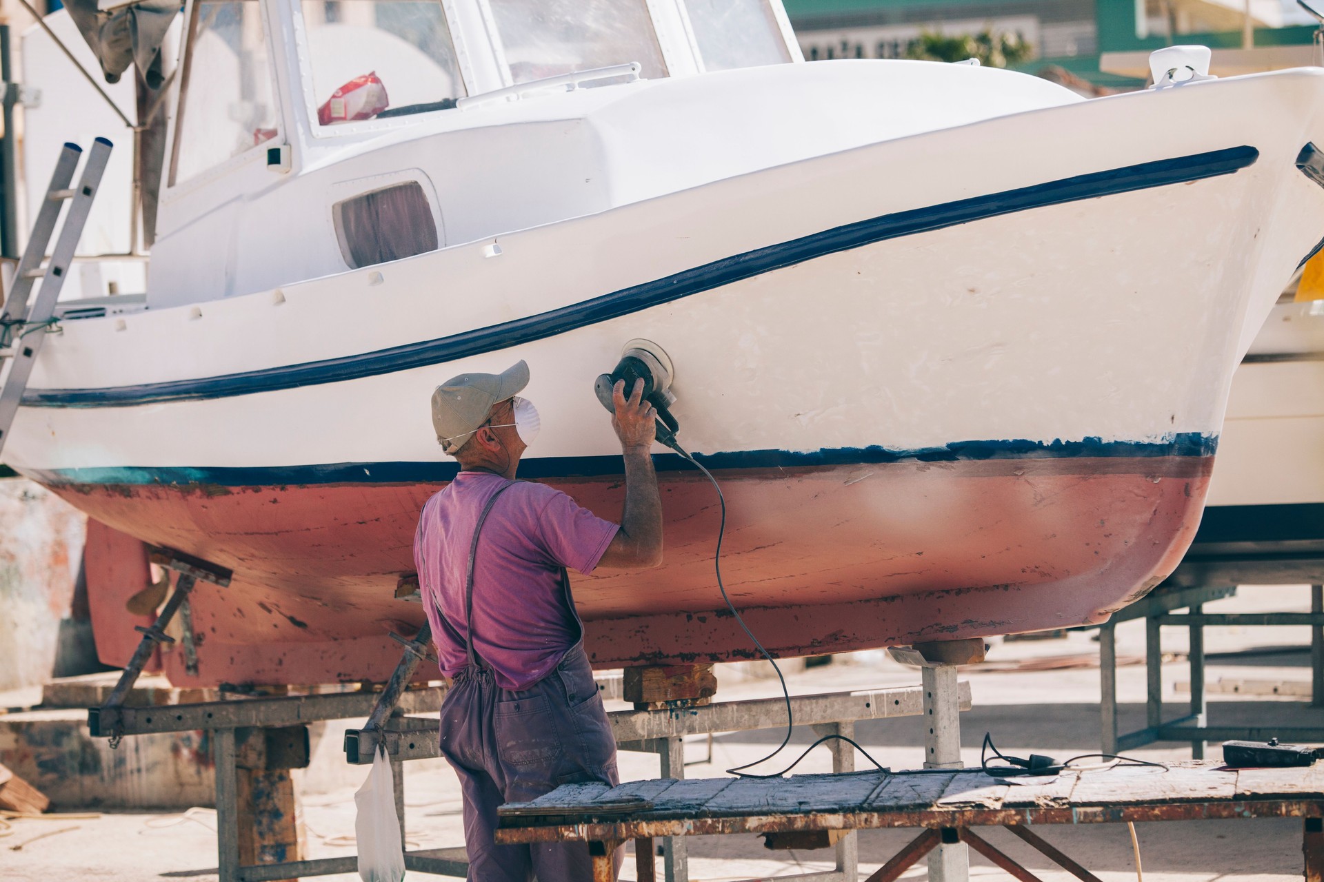 A man prepares a coloring boat.